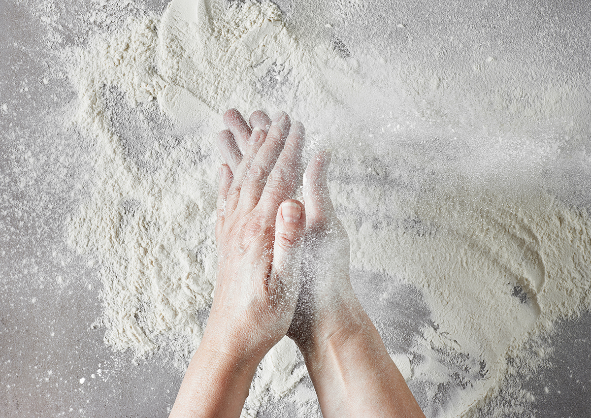 baker hands with flour in motion